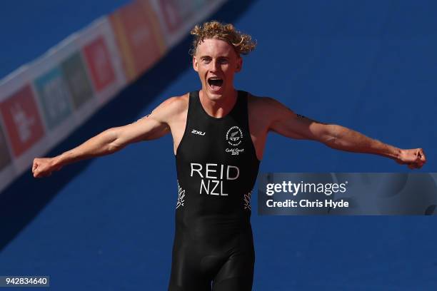 Tayler Reid of New Zeland crosses the line for Bronze in the Triathlon Mixed Team Relay on day three of the Gold Coast 2018 Commonwealth Games at...