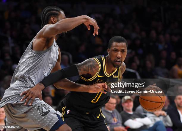 Andrew Wiggins of the Minnesota Timberwolves guards Kentavious Caldwell-Pope of the Los Angeles Lakers as he drives to the basket in the second half...