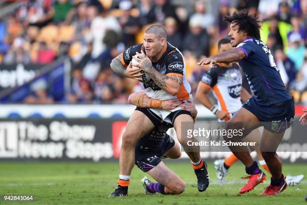 Russell Packer of the Tigers is tackled during the round five NRL match between the Wests Tigers and the Melbourne Storm at Mt Smart Stadium on April...