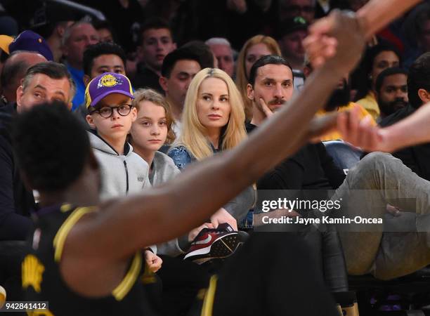 Zlatan Ibrahimovi of the Los Angeles Galaxy attends the game between the Los Angeles Lakers and the Minnesota Timberwolves with his wife Helena...