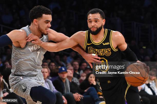 Tyus Jones of the Minnesota Timberwolves guards Tyler Ennis of the Los Angeles Lakers as he drives to the basket in the second half of the game at...