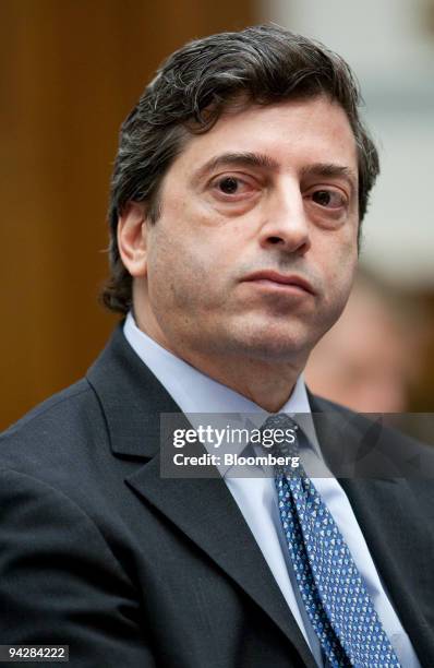 Robert Khuzami, director of enforcement with the U.S. Securities and Exchange Commission, listens to Sheila Bair, chairman of the Federal Deposit...