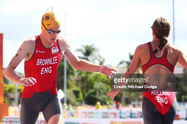 Jonathan Brownlee of England is tagged by Vicky Holland in the Mixed Team relay during the Triathlon on day three of the Gold Coast 2018 Commonwealth...