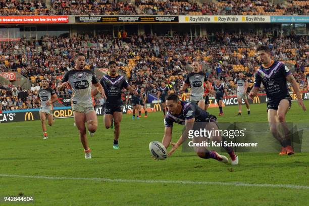 Billy Slater of the Storm dives over to score a try during the round five NRL match between the Wests Tigers and the Melbourne Storm at Mt Smart...