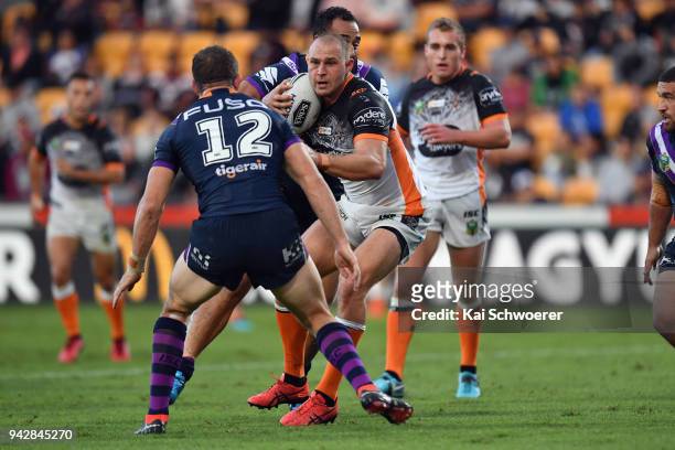 Robbie Rochow of the Tigers charges forward during the round five NRL match between the Wests Tigers and the Melbourne Storm at Mt Smart Stadium on...