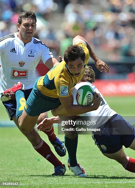 Nick Phipps of Australia tackled by Alexander Yanyuskin of Russia during the IRB Sevens Series match between Australia and Russia at Quteniqua Park...