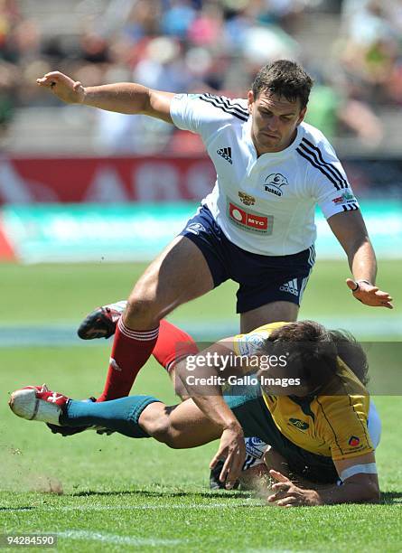 Nick Phipps of Australia tackled by Alexander Ynyuskin and Nikolay Goroshilov of Russia during the IRB Sevens Series match between Australia and...