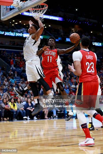 Jrue Holiday of the New Orleans Pelicans shoots over Ivan Rabb of the Memphis Grizzlies during the first half of a NBA game at the Smoothie King...