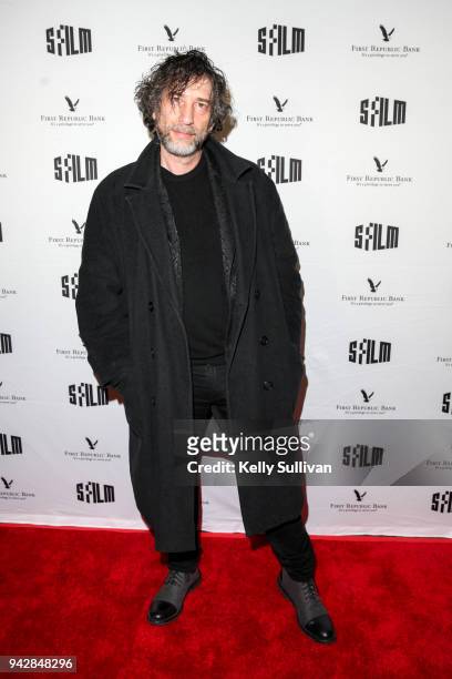 Author Neil Gaiman poses for photos on the red carpet for "How To Talk To Girls At Parties" during the San Francisco International Film Festival at...
