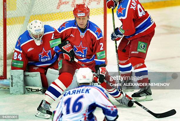 Famous Soviet, former NHL Detroit Red Wings' defender Viacheslav Fetisov of CSKA tries to stop the attack of SKA St Petersburg during the regular...