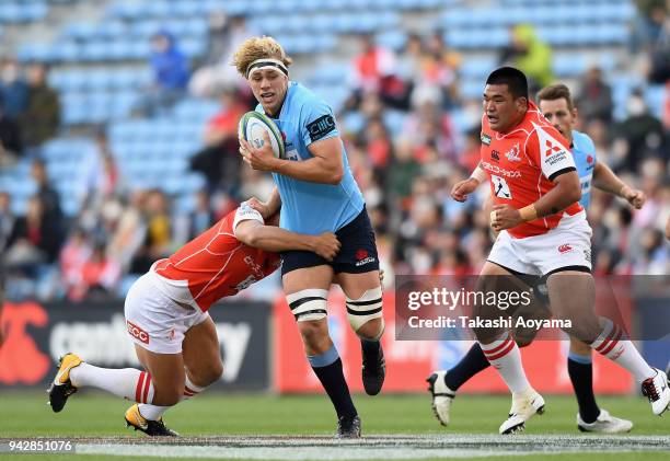 Ned Hanigan of the Waratahs runs with the ball during the Super Rugby match between Sunwolves and Waratahs at Prince Chichibu Memorial Ground on...