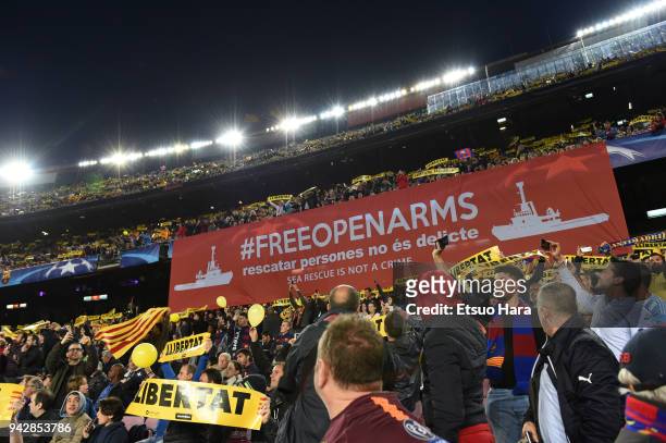 Barcelona fans hold up banners during the UEFA Champions League Quarter Final First Leg between FC Barcelona adn AS Roma at Camp Nou on April 4, 2018...