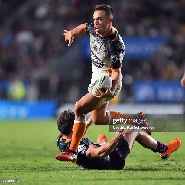 Luke Brooks of the Tigers charges forward during the round five NRL match between the Wests Tigers and the Melbourne Storm at Mt Smart Stadium on...