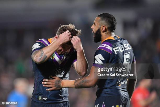 Cameron Munster and Josh Addo-Carr of the Storm look dejected after their loss in the round five NRL match between the Wests Tigers and the Melbourne...