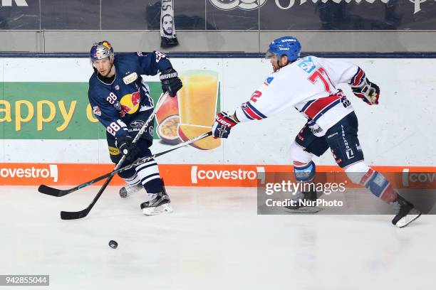 Nikolai Goc of Adler Mannheim vies Frank Mauer of Red Bull Munich during the DEL Playoff semifinal match 5 between EHC Red Bull Munich and Adler...