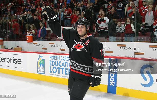 Ray Whitney of the Carolina Hurricanes waves to fans after being named second star of the game after a NHL contest against the Vancouver Canucks...