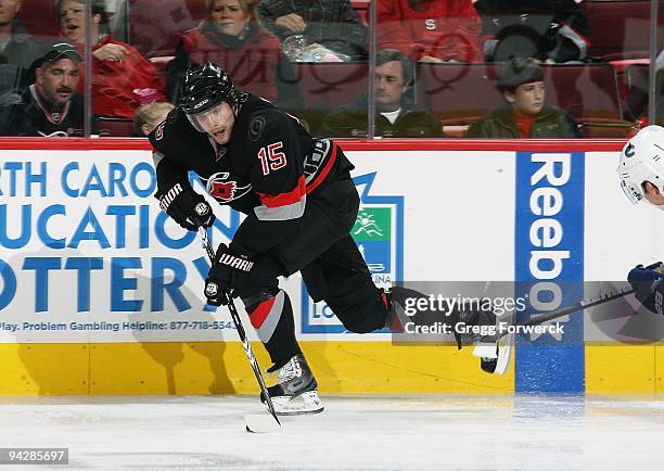 Tuomo Ruutu of the Carolina Hurricanes skates along the boards with the puck during a NHL game against the Vancouver Canucks on December 5, 2009 at...
