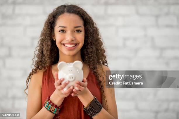 saving up money - financial wellbeing stock pictures, royalty-free photos & images
