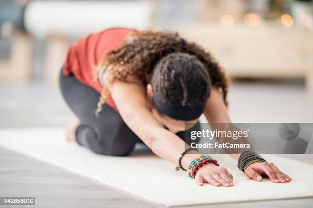 stretching exercise - teenager meditating stock pictures, royalty-free photos & images
