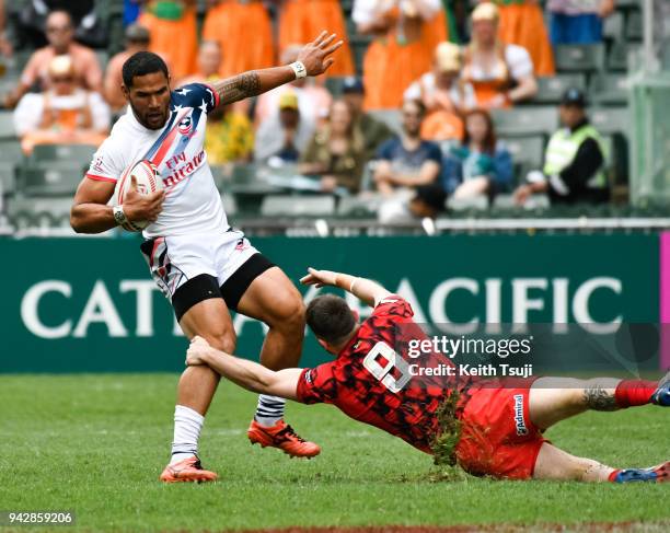 Martin Iosefo of United States is tackled by Afon Bagshaw of Wales during the second day of the Hong Kong Sevens on April 7, 2018 in Hong Kong.
