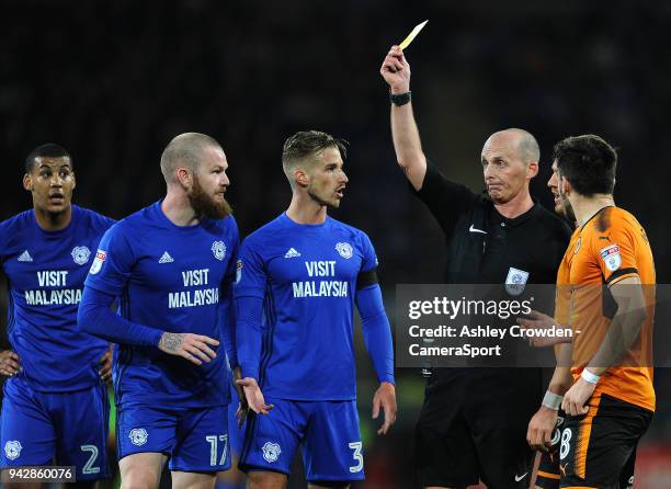 Cardiff City's Joe Bennett is given a yellow card from Mike Dean during the Sky Bet Championship match between Cardiff City and Wolverhampton...