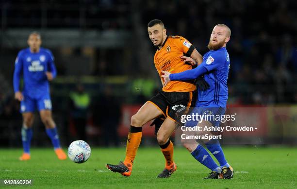 Wolverhampton Wanderers' Romain Saiss vies for possession with Cardiff City's Aron Gunnarsson during the Sky Bet Championship match between Cardiff...