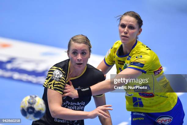 Bucharest's Isabelle Gullden vies Metz Handball's Xenia Smits during 2017/18 EHF Women's Champions League Quarter Final match between CSM Bucharest...