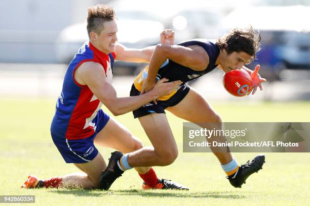 Mitch Goodwin of the Pioneers and Riley Baldi of the Power contest the ball during the round three TAC Cup match between Bendigo Pioneers and...