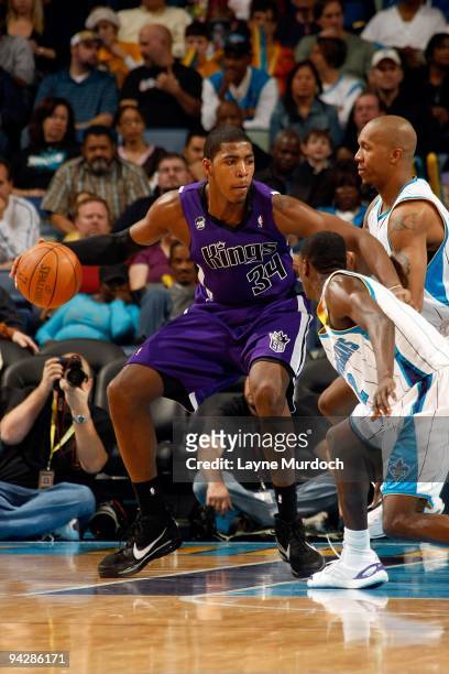 Jason Thompson of the Sacramento Kings posts up against David West of the New Orleans Hornets during the game on December 8, 2009 at the New Orleans...