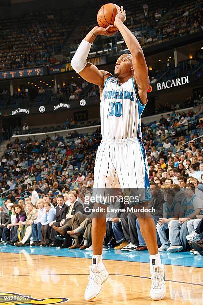 David West of the New Orleans Hornets shoots against the Sacramento Kings during the game on December 8, 2009 at the New Orleans Arena in New...