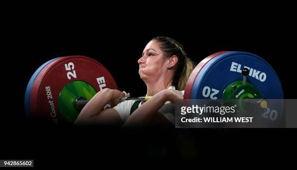 Mona Pretorius of South Africa lifts on the way to winning the bronze medal in the women's 63kg weightlifting event at the 2018 Gold Coast...