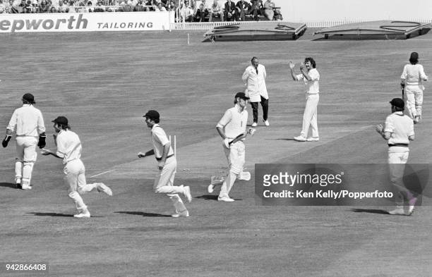 Australian players celebrate after England captain Tony Greig is run out for 51 runs in the 3rd Test Match match between England and Australia at...