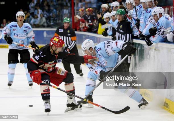 Vitalij Aab of Hamburg and Nikolai Goc of Hannover fight for the puck during the DEL match between Hamburg Freezers and Hannover Scorpions at the...