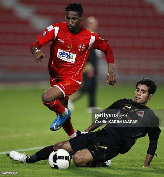 Al-Arabi's Mohammed al-Mal jumps over Al-Rayyan's Yunes Ali during their Qatar Stars League football match in Doha on December 11, 2009. Rayyan won...