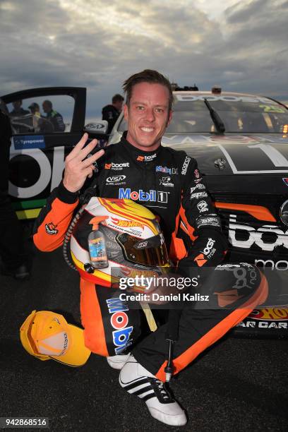 James Courtney driver of the Mobil 1 Boost Mobile Racing Holden Commodore ZB celebrates after finishing third in race 1 for the Supercars Tasmania...