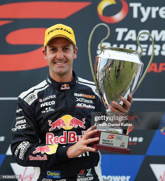 Jamie Whincup driver of the Red Bull Holden Racing Team Holden Commodore ZB poses for a photo with his Ben Rohrer of the Sydney Thunderphy after...