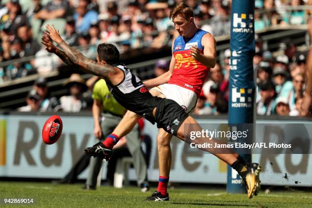 Chad Wingard of the Power tackles Harris Andrews of the Lions during the 2018 AFL round 03 match between the Port Adelaide Power and the Brisbane...