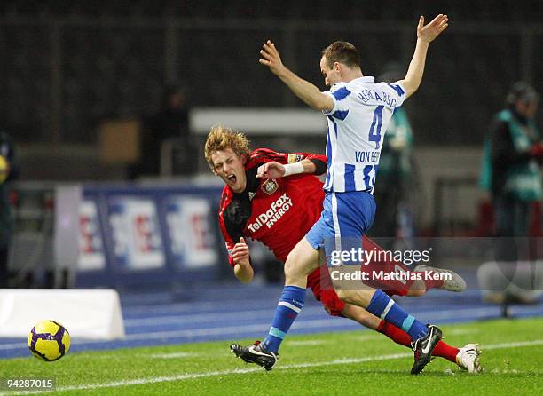 Stefan Kiessling of Leverkusen battles for the ball with Steve von Bergen of Berlin during the Bundesliga match between Hertha BSC Berlin and Bayer...