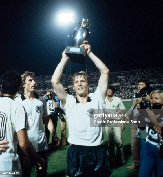 Karl-Heinz Foerster of West Germany lifts the trophy after the UEFA Euro 1980 Final between Belgium and West Germany at the Stadio Olympico on June...