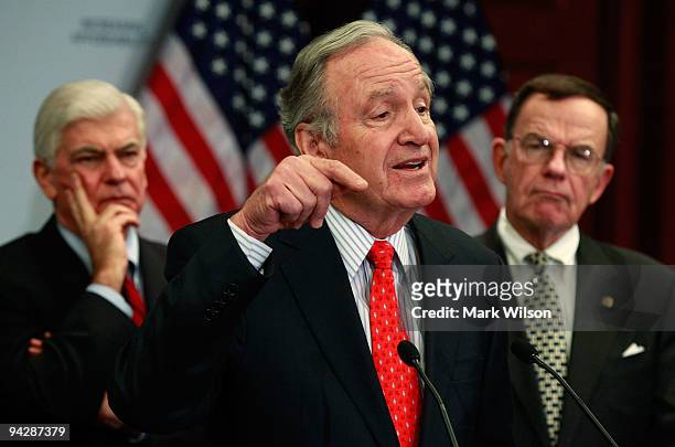 Sen. Tom Harkin speaks while flanked by Sen. Christopher Dodd ,and Sen. Paul Kirk during a news conference on health care reform on Capitol Hill on...
