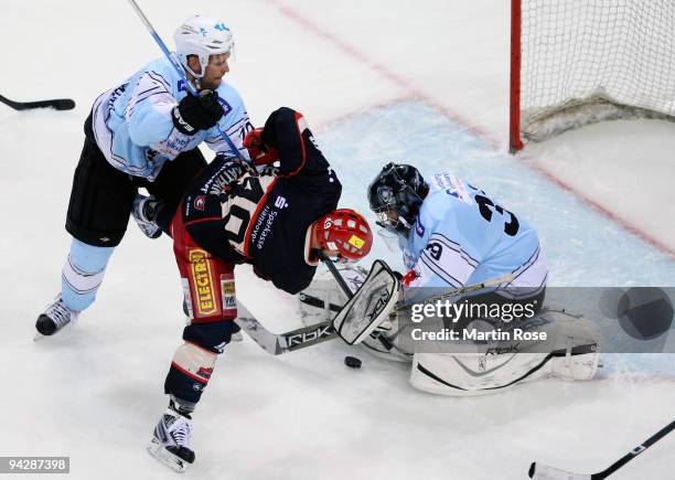 Klaus Kathan of Hannover tries to score over goalkeeper Domenic Bartels of Hamburg during the DEL match between Hamburg Freezers and Hannover...