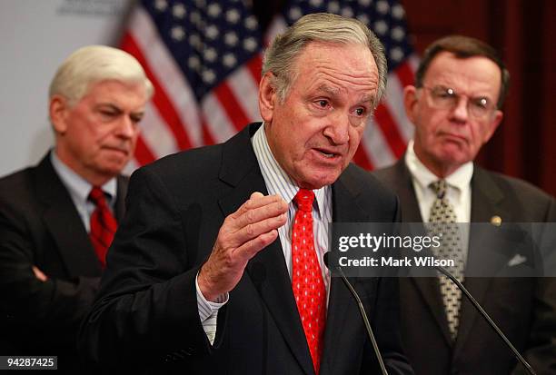 Sen. Tom Harkin speaks while flanked by Sen. Christopher Dodd and Sen. Paul Kirk during a news conference on health care reform on Capitol Hill on...