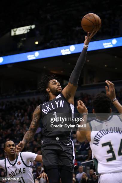 Angelo Russell of the Brooklyn Nets attempts a shot past Giannis Antetokounmpo of the Milwaukee Bucks in the first quarter at the Bradley Center on...
