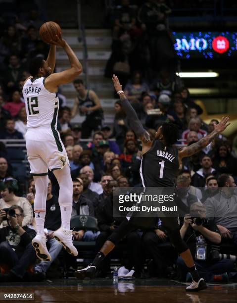 Jabari Parker of the Milwaukee Bucks attempts a shot while being guarded by D'Angelo Russell of the Brooklyn Nets in the first quarter at the Bradley...