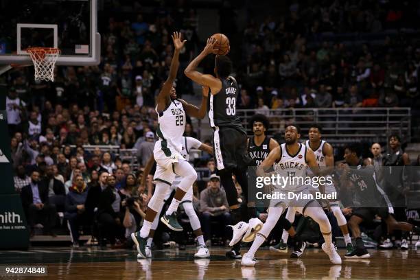 Allen Crabbe of the Brooklyn Nets attempts a shot while being guarded by Khris Middleton of the Milwaukee Bucks in the fourth quarter at the Bradley...