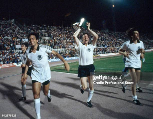 Horst Hrubesch of West Germany takes the trophy on a lap of honour after the UEFA Euro 1980 Final between Belgium and West Germany at the Stadio...