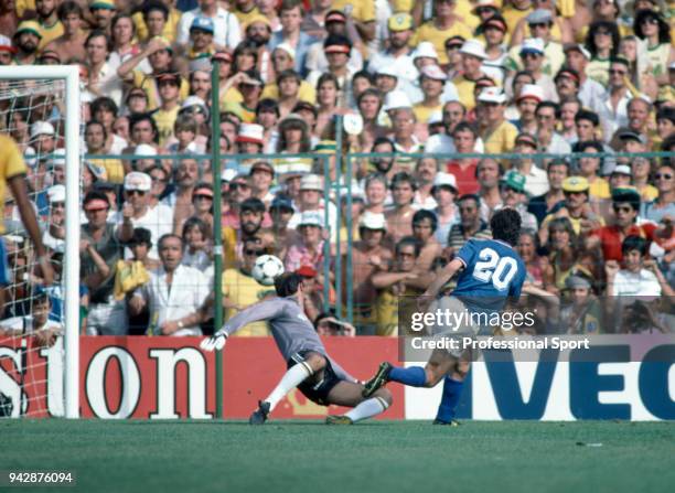 Paolo Rossi of Italy scores past Waldir Peres of Brazil during a FIFA World Cup 2nd Group Stage match at the Sarrià Stadium on July 5, 1982 in...