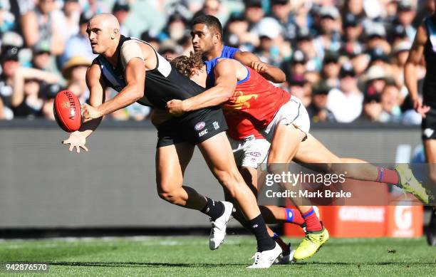 Sam Powell-Pepper of Port Adelaide handballs during the round three AFL match between the Port Adelaide Power and the Brisbane Lions at Adelaide Oval...