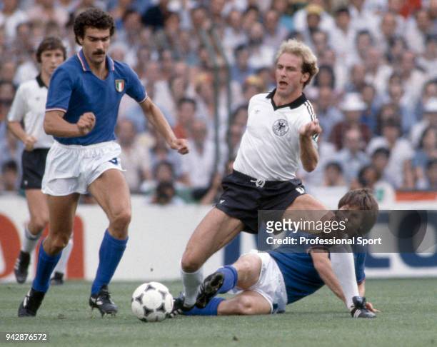 Giuseppe Bergomi of Italy battles for the ball with Karl-Heinz Rummenigge of West Germany during the FIFA World Cup Final at the Bernabéu Stadium on...