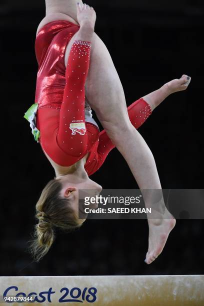 Britain's Alice Kinsella competes on the balance beam during the women's individual all-around final in the artistic gymnastics event during the 2018...